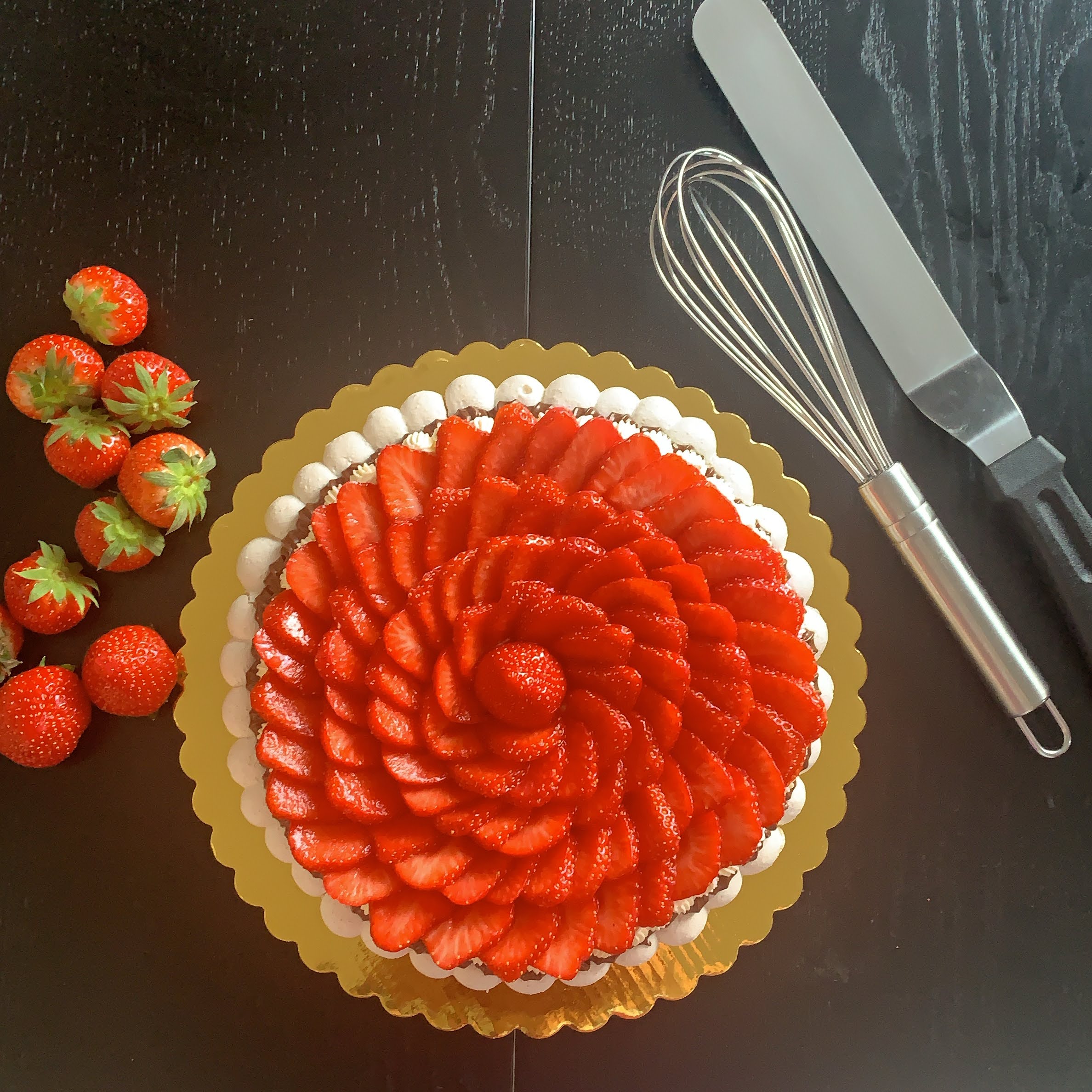 Cakish Strawberry Pavlova — handcrafted meringue topped with fresh strawberries arranged in a floral pattern, made in Wicklow, Ireland.